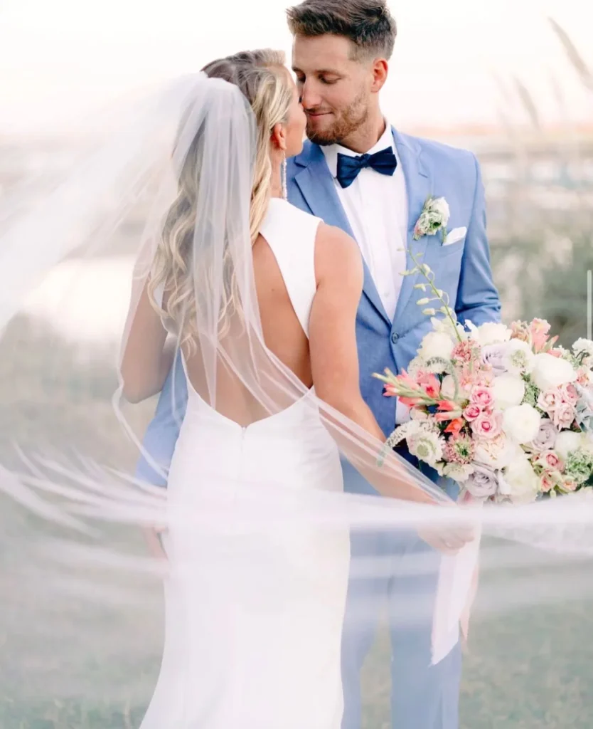 Who says grooms can't have something blue on their wedding day too? This groom's blue suit from generationtux is the