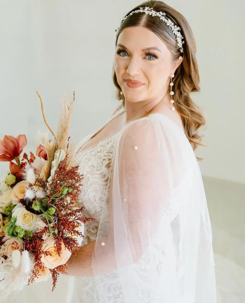 Where do we even begin with this bride's stunning fashion?! From the veil vape to the pearl and lace bodice