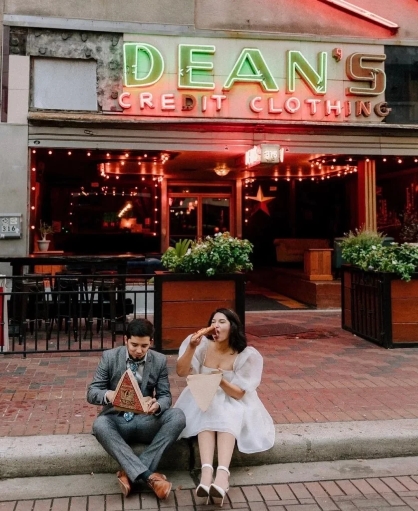 A VIBE. 🍕⁠ This is what engagement shoot dreams are made of. The puff-sleeved tulle dress, downtown pizza hub, and